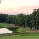 Panoramic view of a lush green golf course at Shaker Hills Country Club. Smooth