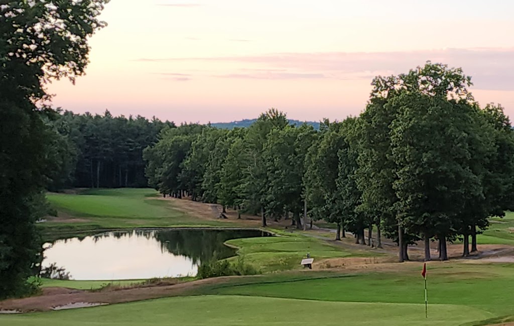 Panoramic view of a lush green golf course at Shaker Hills Country Club. Smooth