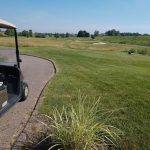 green grass with the flag in the hole.