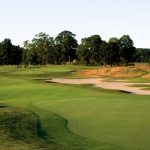 Panoramic view of a lush green golf course at Shale Creek Golf Club. Smooth