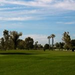 Panoramic view of a lush green golf course at Shalimar Golf Club. Smooth