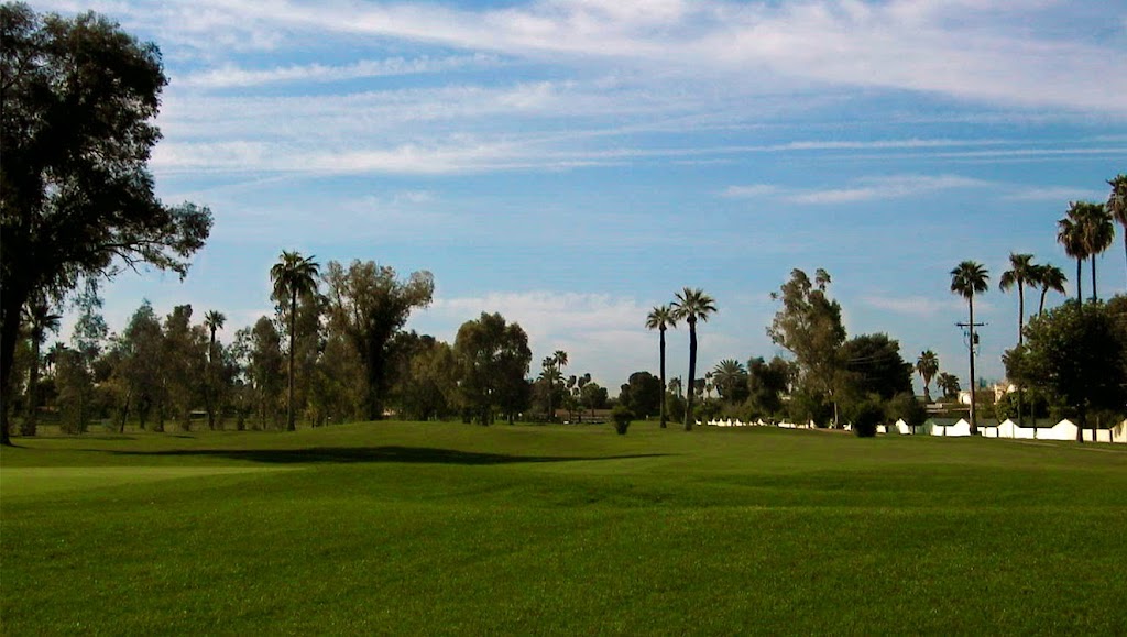 Panoramic view of a lush green golf course at Shalimar Golf Club. Smooth