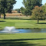 Panoramic view of a lush green golf course at Shamrock Hills Golf Club. Smooth