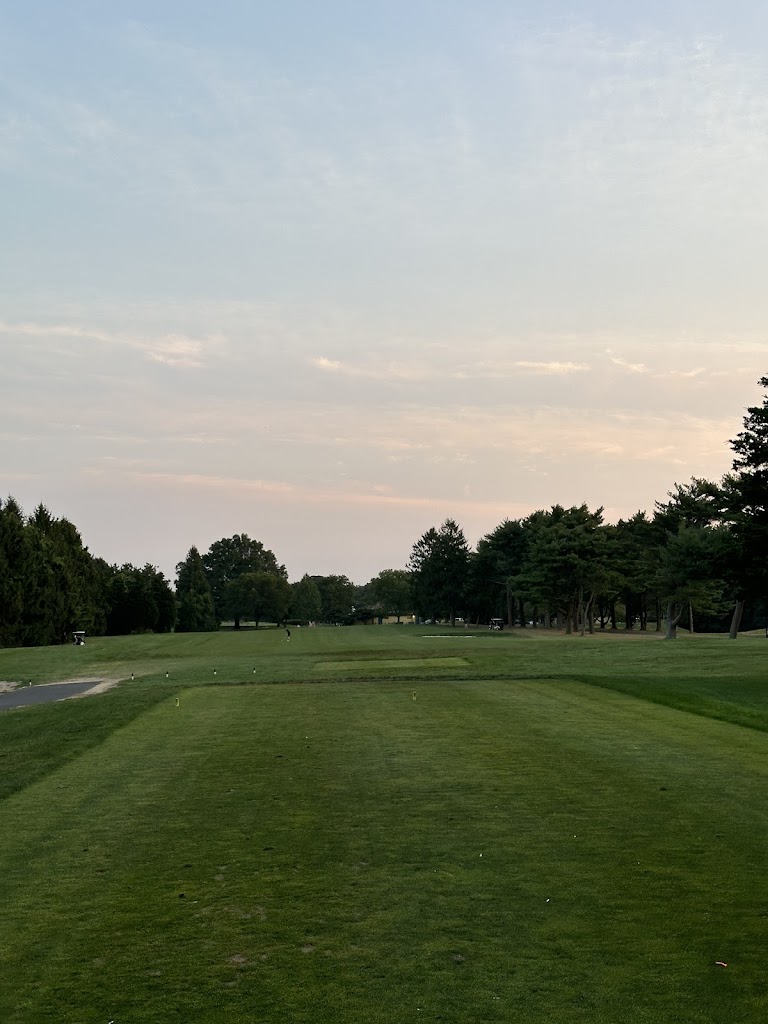 Panoramic view of a lush green golf course at Shark River Golf Course. Smooth