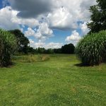 Panoramic view of a lush green golf course at Shawnee Golf Course. Smooth