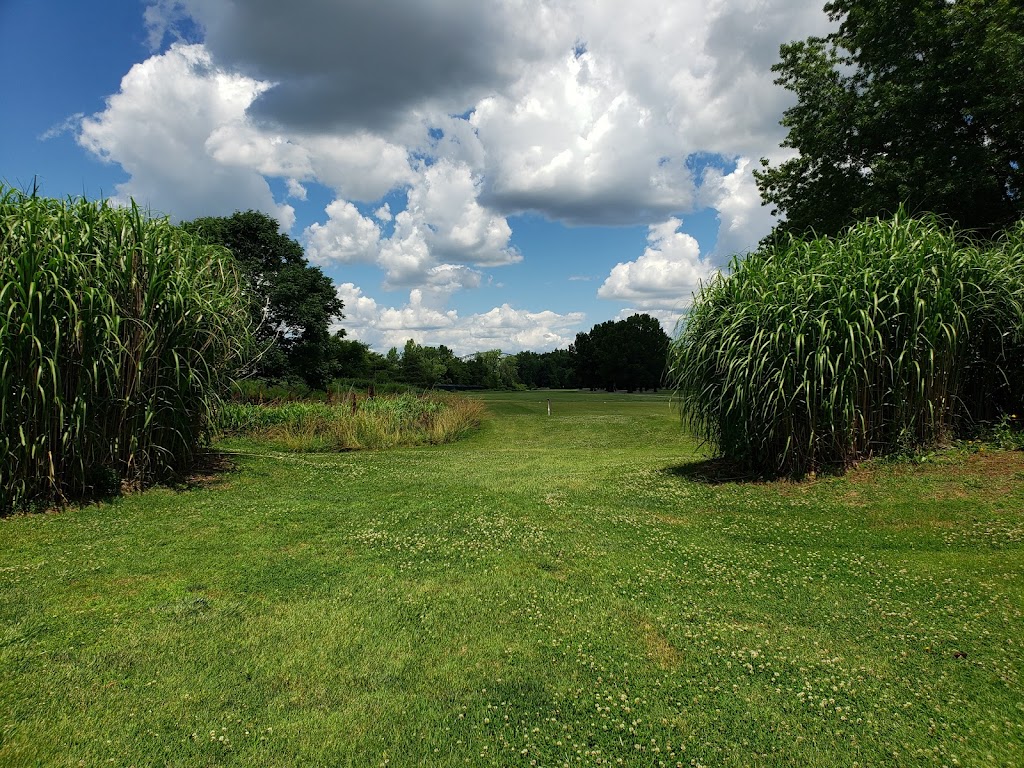 Panoramic view of a lush green golf course at Shawnee Golf Course. Smooth