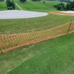 Panoramic view of a lush green golf course at Shelby Golf Course. Smooth
