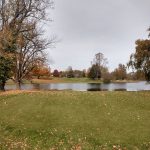 Panoramic view of a lush green golf course at Shelbyville Country Club. Smooth