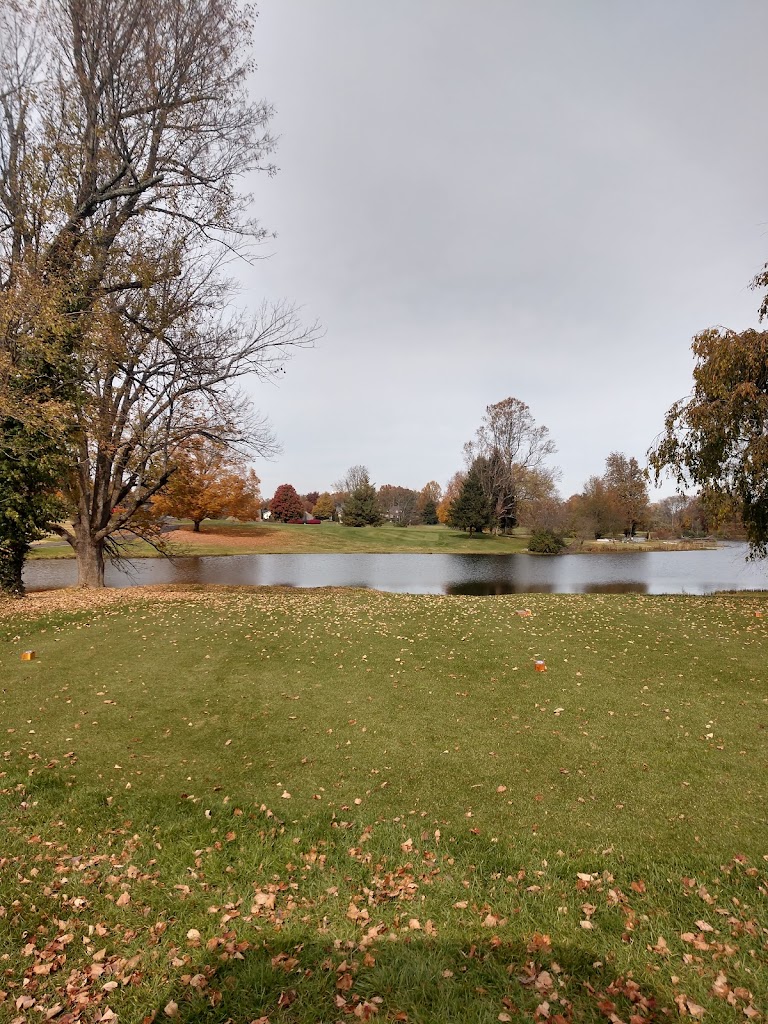 Panoramic view of a lush green golf course at Shelbyville Country Club. Smooth