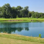 Panoramic view of a lush green golf course at Sherrill Park Golf Course. Smooth