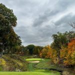 Panoramic view of a lush green golf course at Shoreacres. Smooth