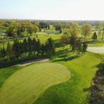 Panoramic view of a lush green golf course at Silver Lake Country Club. Smooth