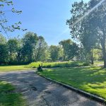 Panoramic view of a lush green golf course at Silver Lake Golf Course. Smooth