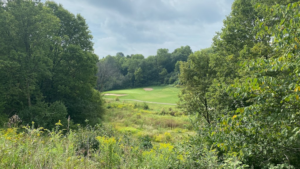 Panoramic view of a lush green golf course at Silver Ridge Golf Course. Smooth