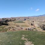 green grass with the flag in the hole.