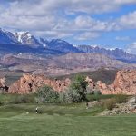 Panoramic view of a lush green golf course at Sky Mountain Golf Course. Smooth