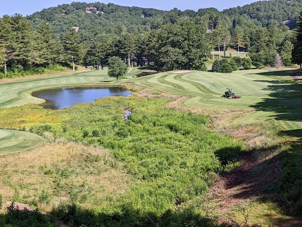 Panoramic view of a lush green golf course at Sky Valley Country Club. Smooth