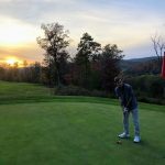 green grass with the flag in the hole.