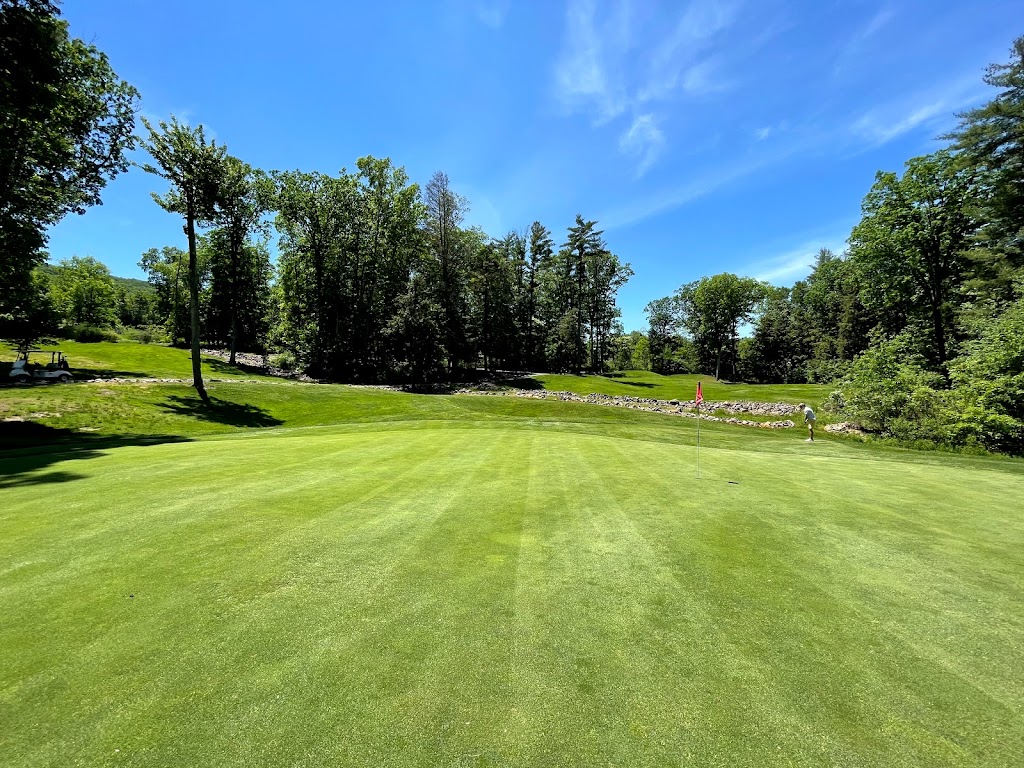 Panoramic view of a lush green golf course at Skytop Mountain Golf Club. Smooth