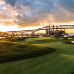 Panoramic view of a lush green golf course at Skyway Golf Course. Smooth
