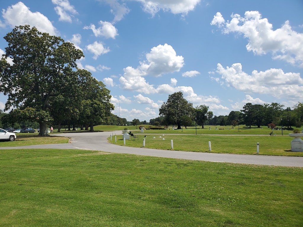Panoramic view of a lush green golf course at Sleepy Hole Golf Course. Smooth