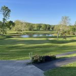 Panoramic view of a lush green golf course at Sleepy Hollow Golf Club. Smooth