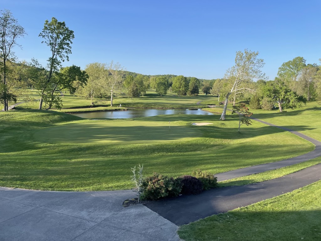 Panoramic view of a lush green golf course at Sleepy Hollow Golf Club. Smooth