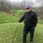 green grass with the flag in the hole.