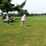 green grass with the flag in the hole.