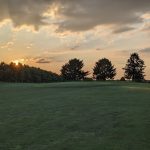 Panoramic view of a lush green golf course at Sleepy Hollow Golf Course. Smooth