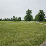 Panoramic view of a lush green golf course at Smock Golf Course. Smooth