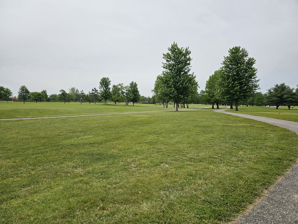 Panoramic view of a lush green golf course at Smock Golf Course. Smooth