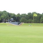 Panoramic view of a lush green golf course at Smyrna Golf Course. Smooth