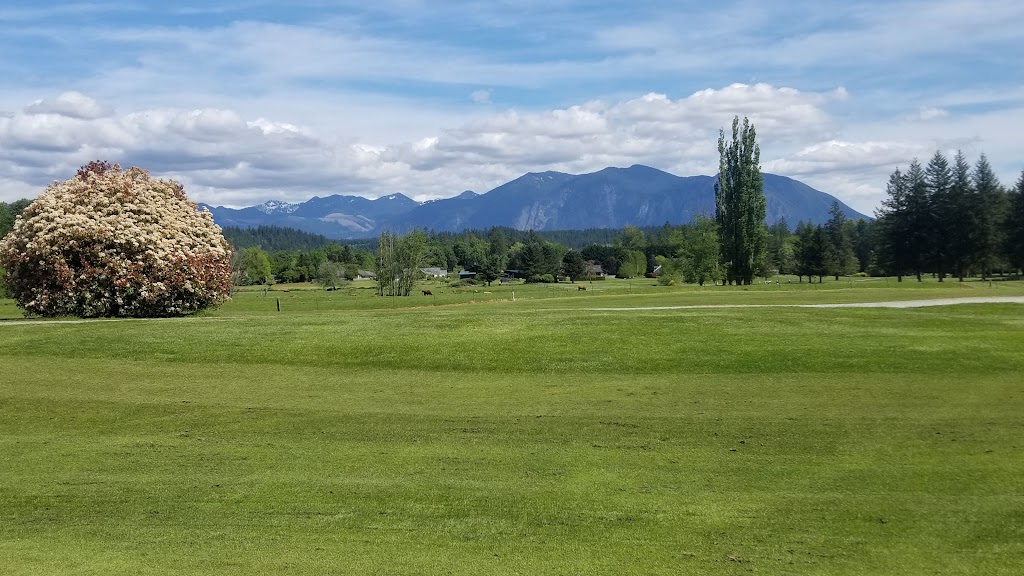 Panoramic view of a lush green golf course at Snoqualmie Falls Golf Course. Smooth
