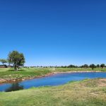 Panoramic view of a lush green golf course at Snowflake Municipal Golf. Smooth