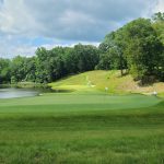 Panoramic view of a lush green golf course at Somerset Hills Country Club. Smooth
