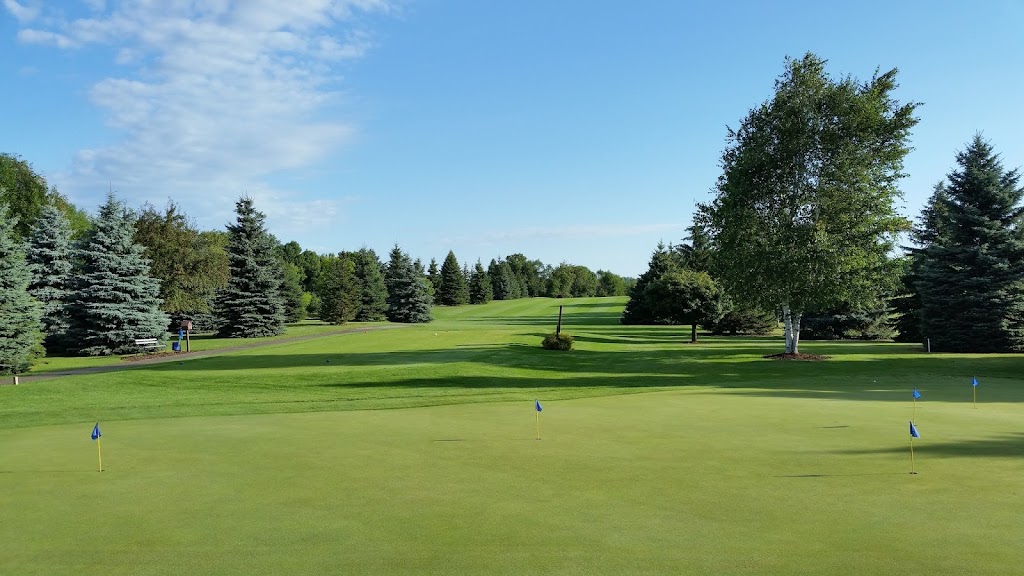 Panoramic view of a lush green golf course at Songbird Hills Golf Club. Smooth