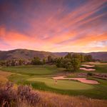Panoramic view of a lush green golf course at Sonnenalp Club. Smooth