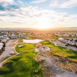 Panoramic view of a lush green golf course at Sonoma Ranch Golf Course. Smooth