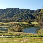 Panoramic view of a lush green golf course at Soule Park Golf Course. Smooth