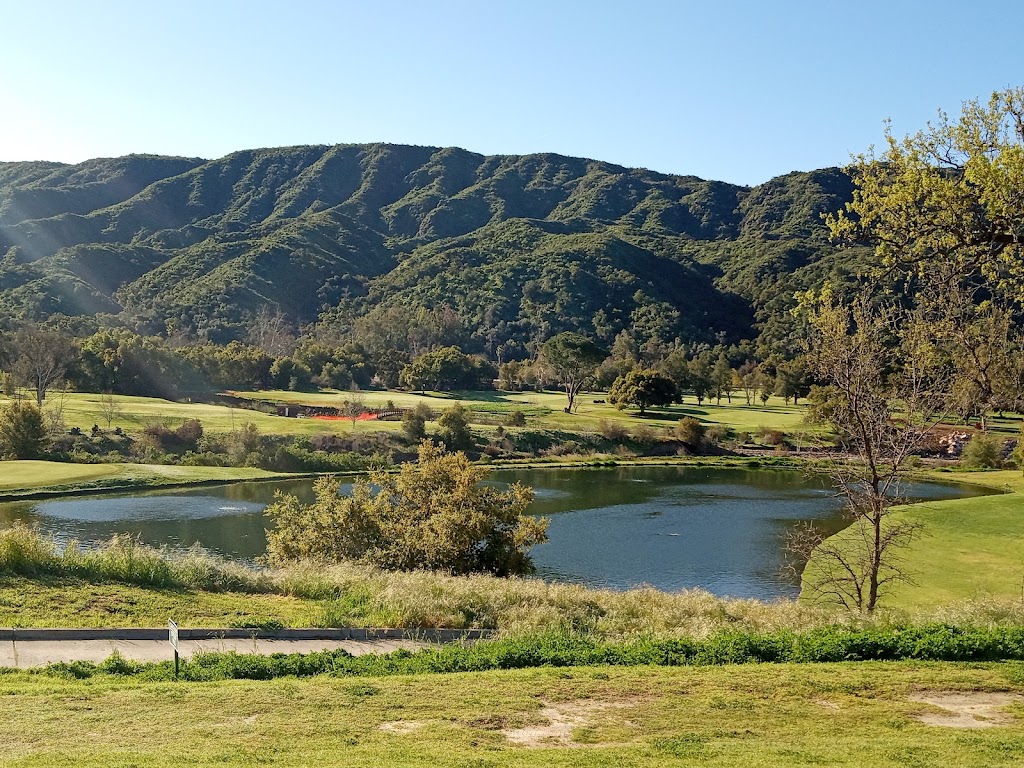 Panoramic view of a lush green golf course at Soule Park Golf Course. Smooth