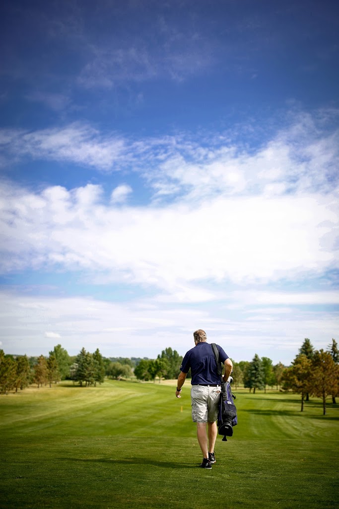 Panoramic view of a lush green golf course at Souris Valley Golf Course. Smooth
