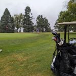 Panoramic view of a lush green golf course at South Hills Golf Course. Smooth