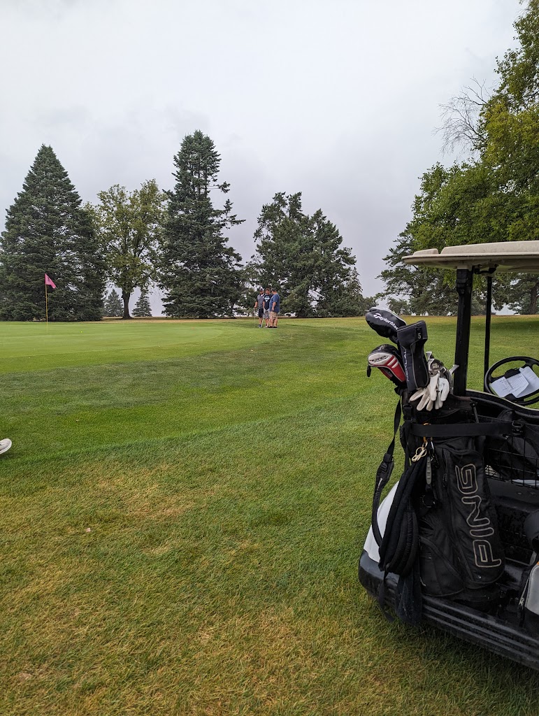 Panoramic view of a lush green golf course at South Hills Golf Course. Smooth