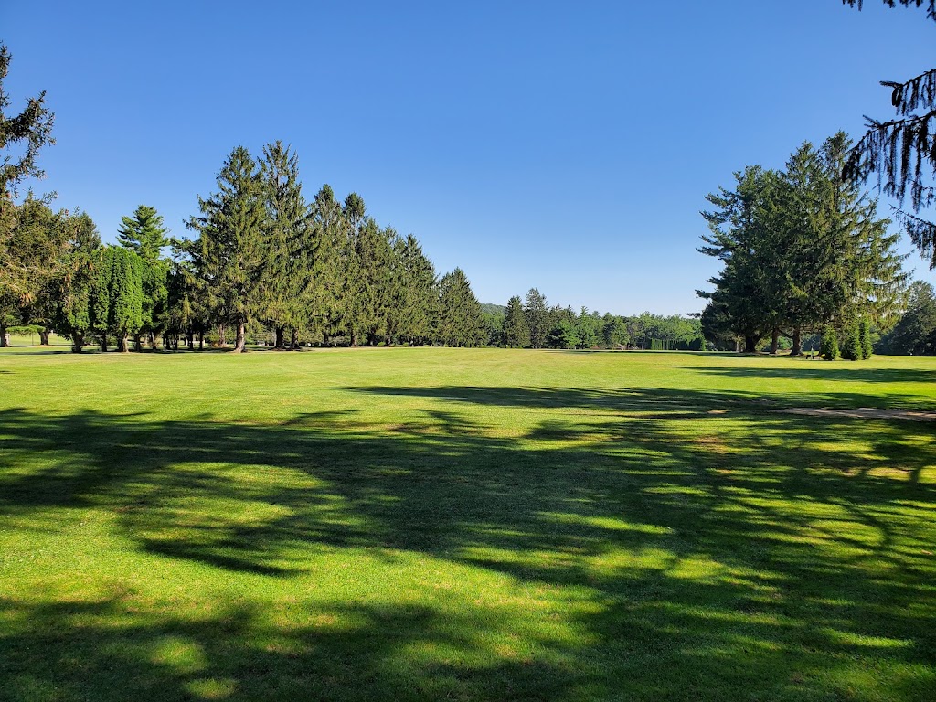 Panoramic view of a lush green golf course at South Mountain Golf Course. Smooth