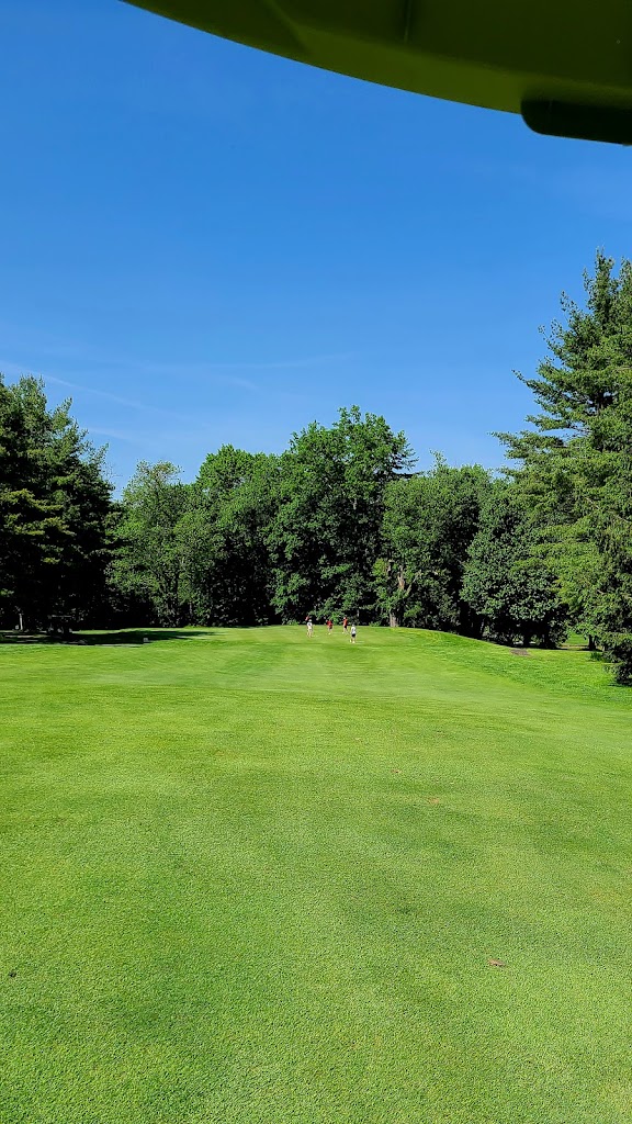 Panoramic view of a lush green golf course at Southampton Country Club. Smooth