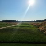 Panoramic view of a lush green golf course at Southampton Golf Club. Smooth