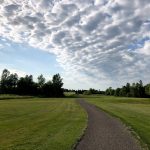 Panoramic view of a lush green golf course at Southbrook Golf Course. Smooth