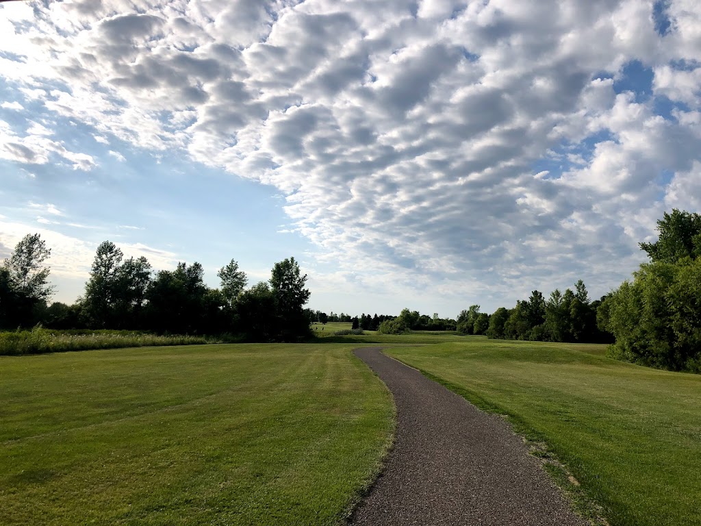 Panoramic view of a lush green golf course at Southbrook Golf Course. Smooth