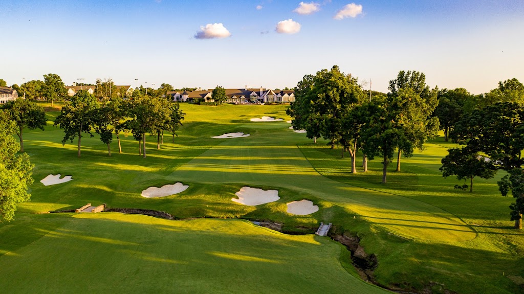 Panoramic view of a lush green golf course at Southern Hills Country Club. Smooth